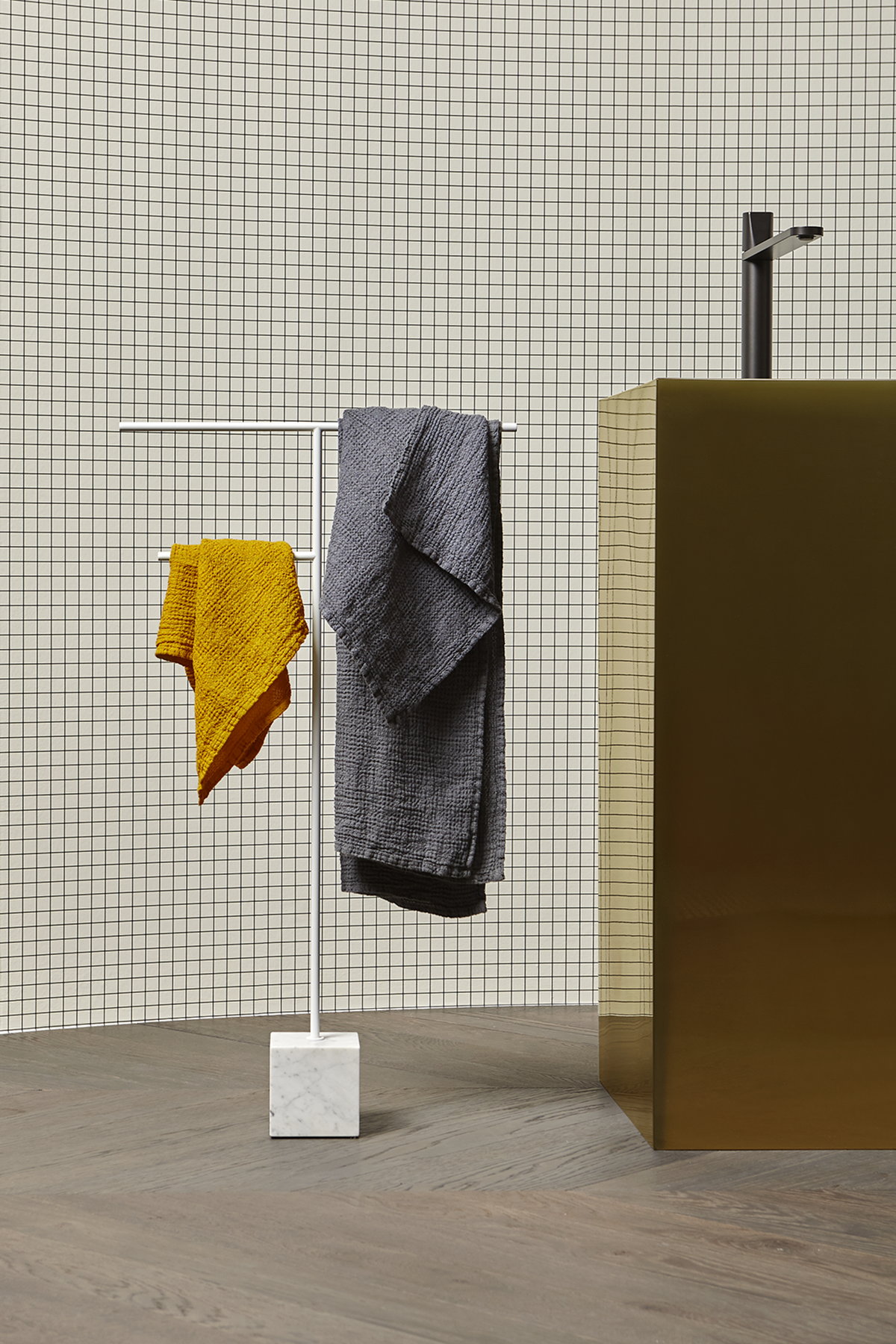 The cubic marble base refers to the precious heritage of the earth
